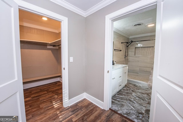 5763 Houston Rd, Macon, GA 31216 - spacious closet featuring dark wood-style floors and a sink