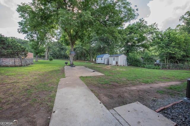5763 Houston Rd, Macon, GA 31216 - view of yard with a storage unit, a patio area, and view of scattered trees