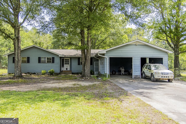 83 Manning Lake Rd SW, Rome, GA 30165 - ranch-style house featuring concrete driveway, a garage, a front lawn, and view of wooded area