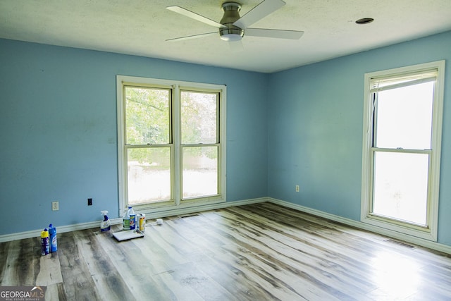 83 Manning Lake Rd SW, Rome, GA 30165 - empty room featuring a ceiling fan and wood finished floors