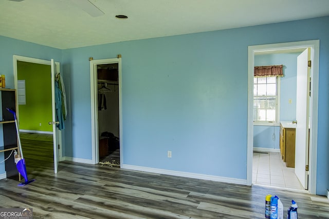 83 Manning Lake Rd SW, Rome, GA 30165 - unfurnished bedroom with wood finished floors and connected bathroom