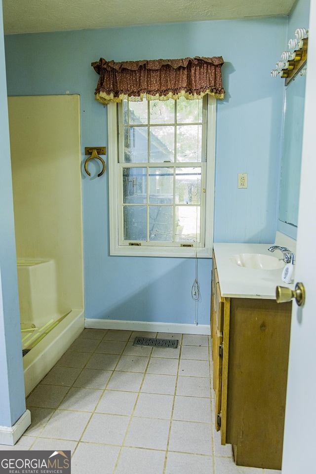 83 Manning Lake Rd SW, Rome, GA 30165 - full bathroom with vanity, tile patterned floors, and a shower