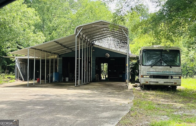 83 Manning Lake Rd SW, Rome, GA 30165 - view of car parking with concrete driveway and a detached carport