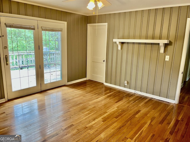 201 Glen Iris Dr, Monroe, GA 30655 - unfurnished room with crown molding, hardwood / wood-style flooring, and ceiling fan