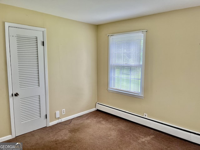201 Glen Iris Dr, Monroe, GA 30655 - empty room with baseboard heating and carpet