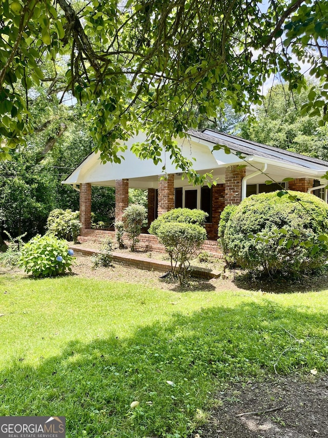 201 Glen Iris Dr, Monroe, GA 30655 - view of front of property with a front yard and brick siding