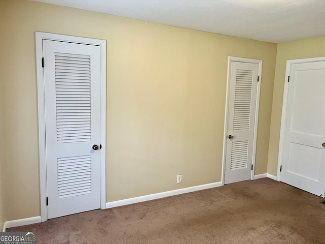 201 Glen Iris Dr, Monroe, GA 30655 - unfurnished bedroom with carpet and baseboards