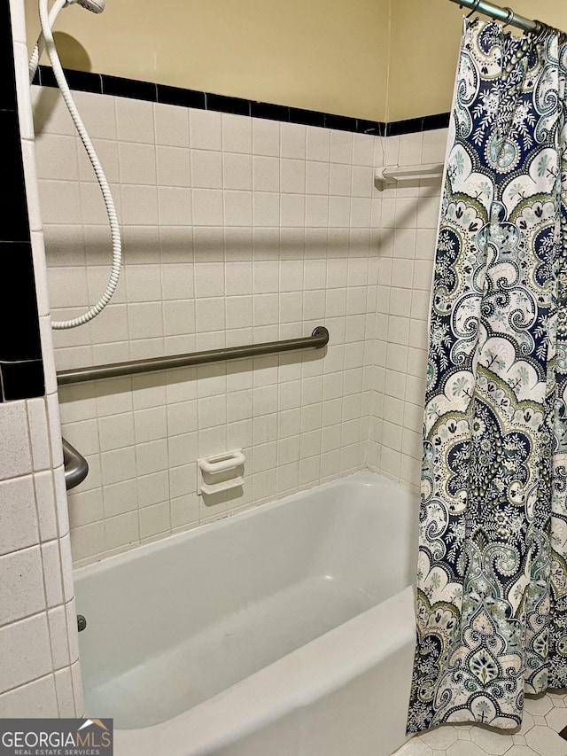 201 Glen Iris Dr, Monroe, GA 30655 - bathroom featuring shower / tub combo with curtain