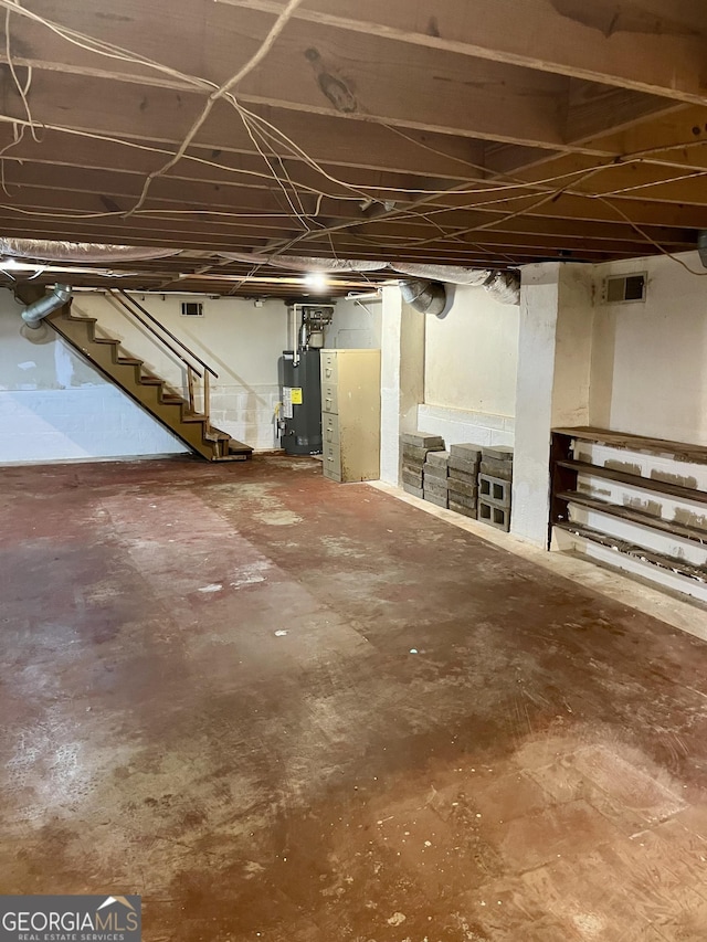 201 Glen Iris Dr, Monroe, GA 30655 - unfinished basement with stairway and water heater