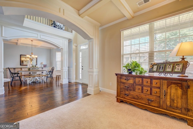 312 Relative Trl, Mcdonough, GA 30253 - foyer with arched walkways, ornate columns, beamed ceiling, a chandelier, and coffered ceiling