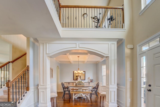 312 Relative Trl, Mcdonough, GA 30253 - foyer with coffered ceiling, arched walkways, plenty of natural light, a chandelier, and a decorative wall