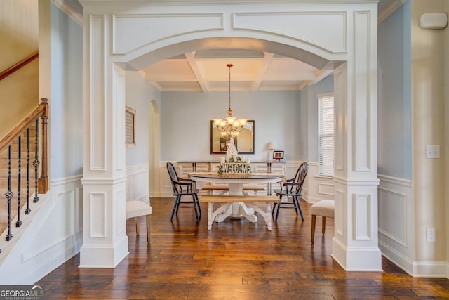 312 Relative Trl, Mcdonough, GA 30253 - dining space featuring coffered ceiling, arched walkways, dark wood-style flooring, beamed ceiling, and a chandelier