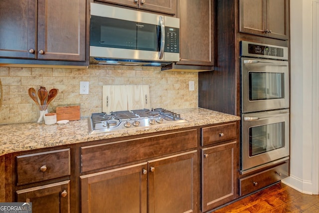 312 Relative Trl, Mcdonough, GA 30253 - kitchen with stainless steel appliances, tasteful backsplash, and light stone counters