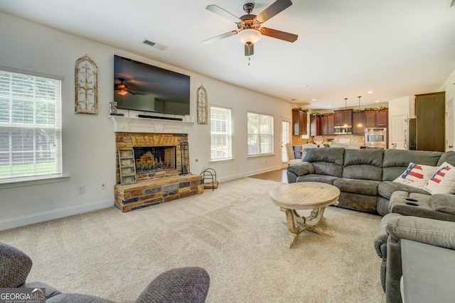 312 Relative Trl, Mcdonough, GA 30253 - carpeted living room featuring a ceiling fan, a stone fireplace, and recessed lighting