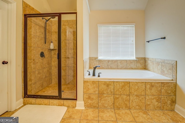 312 Relative Trl, Mcdonough, GA 30253 - full bathroom featuring a garden tub, a shower stall, and tile patterned flooring