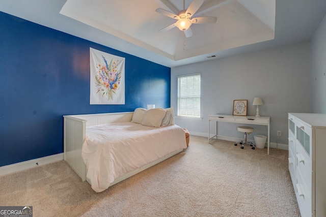 312 Relative Trl, Mcdonough, GA 30253 - carpeted bedroom featuring a tray ceiling and ceiling fan