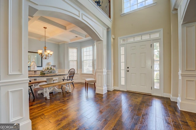 312 Relative Trl, Mcdonough, GA 30253 - foyer entrance featuring arched walkways, coffered ceiling, healthy amount of natural light, dark wood-style flooring, and beamed ceiling