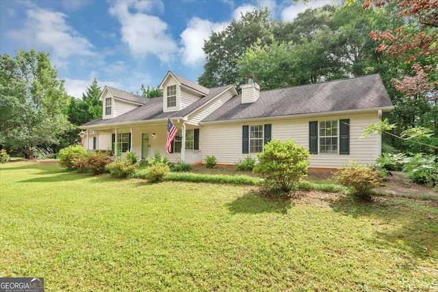 1050 Birdseye Vw, Locust Grove, GA 30248 - new england style home featuring a front yard and a chimney