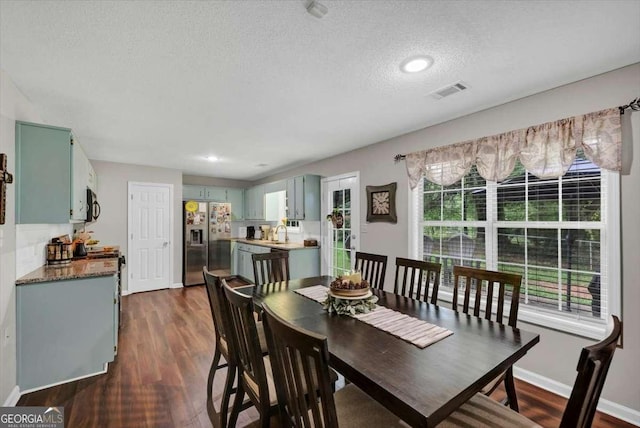 1050 Birdseye Vw, Locust Grove, GA 30248 - dining room with a textured ceiling, dark wood finished floors, and recessed lighting