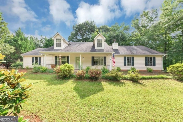 1050 Birdseye Vw, Locust Grove, GA 30248 - cape cod home featuring a front yard and covered porch
