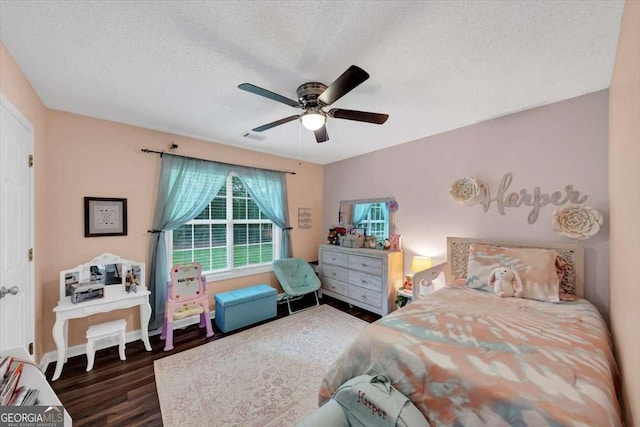 1050 Birdseye Vw, Locust Grove, GA 30248 - bedroom featuring wood finished floors, a textured ceiling, and ceiling fan