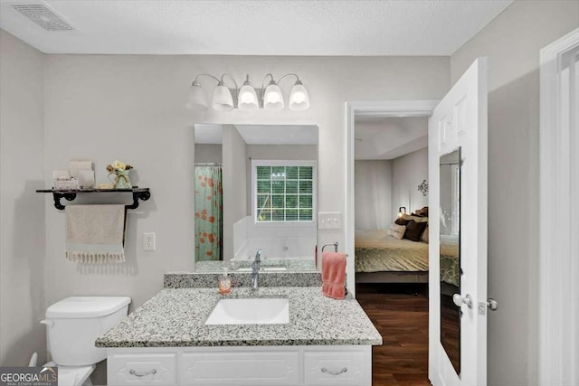 1050 Birdseye Vw, Locust Grove, GA 30248 - bathroom with vanity, wood finished floors, and ensuite bathroom
