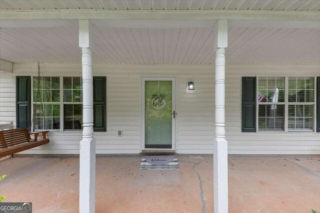 1050 Birdseye Vw, Locust Grove, GA 30248 - doorway to property with covered porch