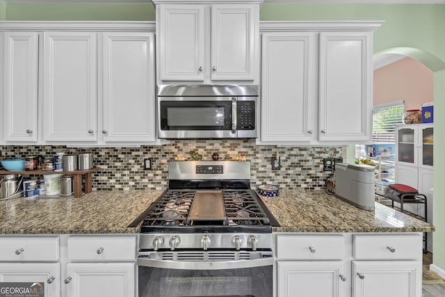 226 Creek View Ln, Acworth, GA 30102 - kitchen featuring appliances with stainless steel finishes, tasteful backsplash, white cabinetry, and stone counters