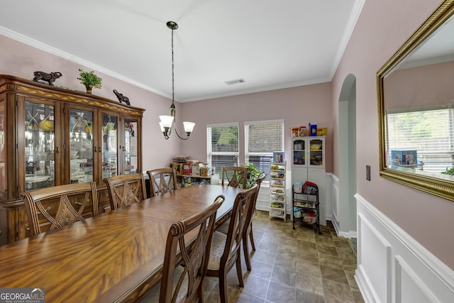 226 Creek View Ln, Acworth, GA 30102 - dining room with arched walkways, crown molding, and stone finish flooring