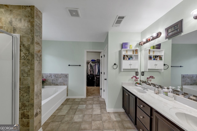 226 Creek View Ln, Acworth, GA 30102 - bathroom with a bath, double vanity, a spacious closet, and stone finish flooring