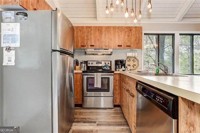 125 Wolfscratch, Big Canoe, GA 30143 - kitchen featuring stainless steel appliances, under cabinet range hood, light countertops, light wood-style floors, and a wooden ceiling with exposed beams
