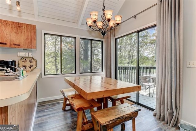 125 Wolfscratch, Big Canoe, GA 30143 - dining space featuring dark wood finished floors, a chandelier, and wood ceiling