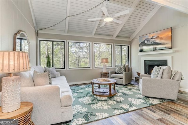 125 Wolfscratch, Big Canoe, GA 30143 - living room with wood finished floors, healthy amount of natural light, a fireplace, ceiling fan, and high vaulted ceiling