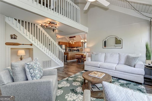 125 Wolfscratch, Big Canoe, GA 30143 - living room featuring a chandelier, wood finished floors, high vaulted ceiling, stairway, and beamed ceiling