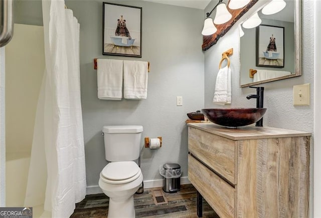 125 Wolfscratch, Big Canoe, GA 30143 - bathroom with vanity, wood finished floors, and a shower with shower curtain