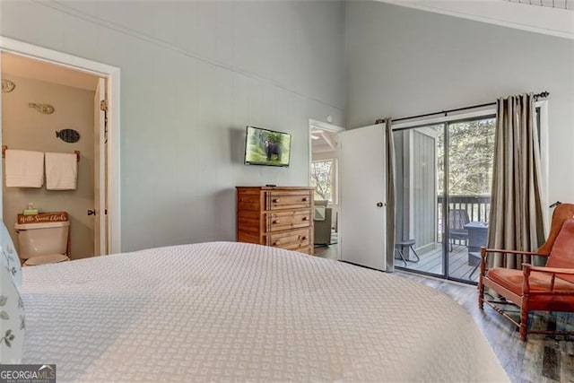 125 Wolfscratch, Big Canoe, GA 30143 - bedroom featuring access to exterior, wood finished floors, and a towering ceiling