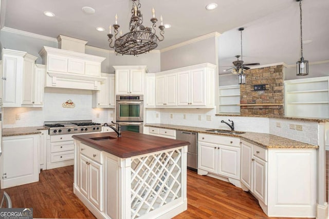 1811 Traditions Way, Jefferson, GA 30549 - kitchen featuring ceiling fan, wood counters, stainless steel appliances, a peninsula, and backsplash