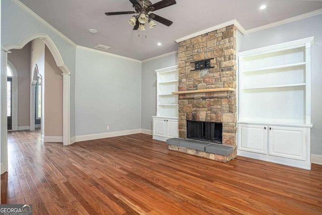 1811 Traditions Way, Jefferson, GA 30549 - unfurnished living room with wood finished floors, ceiling fan, a stone fireplace, ornamental molding, and recessed lighting
