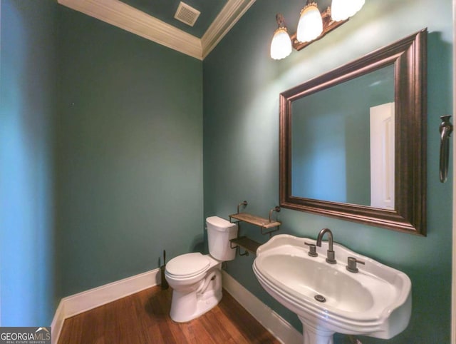 1811 Traditions Way, Jefferson, GA 30549 - half bath featuring ornamental molding and wood finished floors