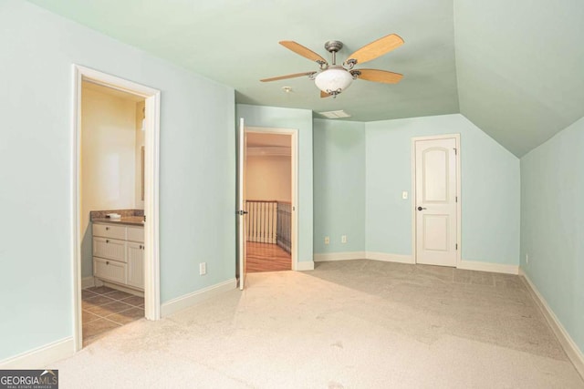 1811 Traditions Way, Jefferson, GA 30549 - unfurnished bedroom with carpet flooring, connected bathroom, a walk in closet, lofted ceiling, and a ceiling fan