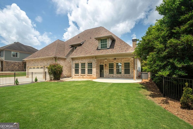 1811 Traditions Way, Jefferson, GA 30549 - rear view of property with a garage, a fenced backyard, a chimney, and a patio area