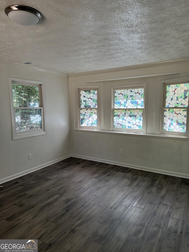 2095 Mulkey Rd SW, Marietta, GA 30008 - spare room with dark wood-style flooring, a textured ceiling, and crown molding