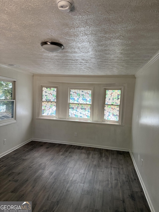 2095 Mulkey Rd SW, Marietta, GA 30008 - unfurnished room featuring a textured ceiling, dark wood-style flooring, a smoke detector, and crown molding