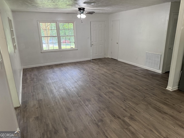 2095 Mulkey Rd SW, Marietta, GA 30008 - unfurnished living room featuring a ceiling fan, dark wood-style flooring, and a textured ceiling
