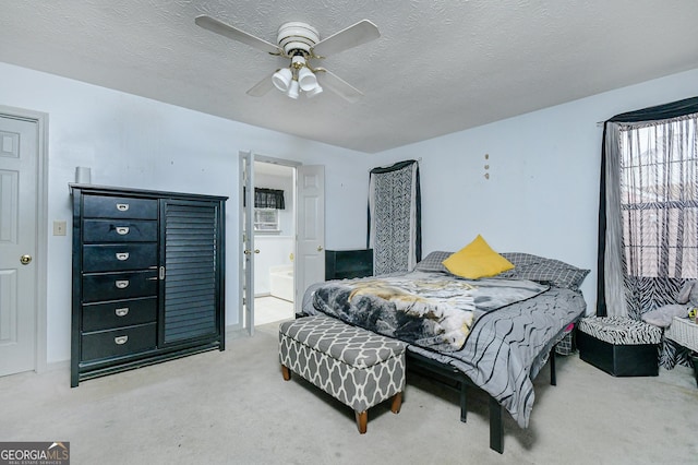 3251 Hunters Crossing Pt, Lithonia, GA 30038 - bedroom with carpet, a textured ceiling, a ceiling fan, and ensuite bathroom