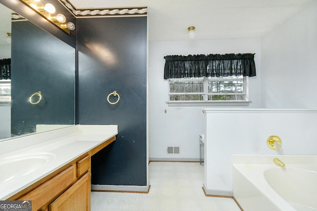 3251 Hunters Crossing Pt, Lithonia, GA 30038 - full bathroom with a garden tub, vanity, plenty of natural light, and tile patterned floors