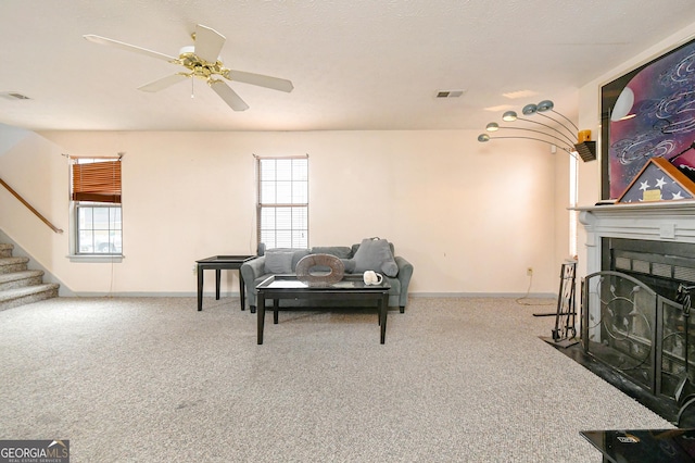 3251 Hunters Crossing Pt, Lithonia, GA 30038 - living room with stairway, healthy amount of natural light, and carpet flooring