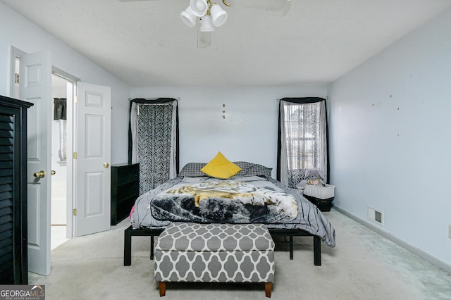 3251 Hunters Crossing Pt, Lithonia, GA 30038 - carpeted bedroom with ceiling fan and baseboards