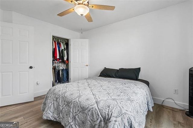 1657 Bradmere Ln, Lithia Springs, GA 30122 - bedroom with wood finished floors, a closet, and a ceiling fan