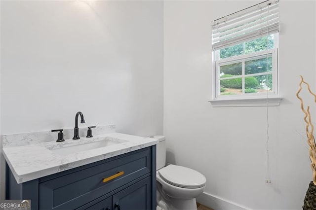 1657 Bradmere Ln, Lithia Springs, GA 30122 - half bathroom featuring toilet and vanity